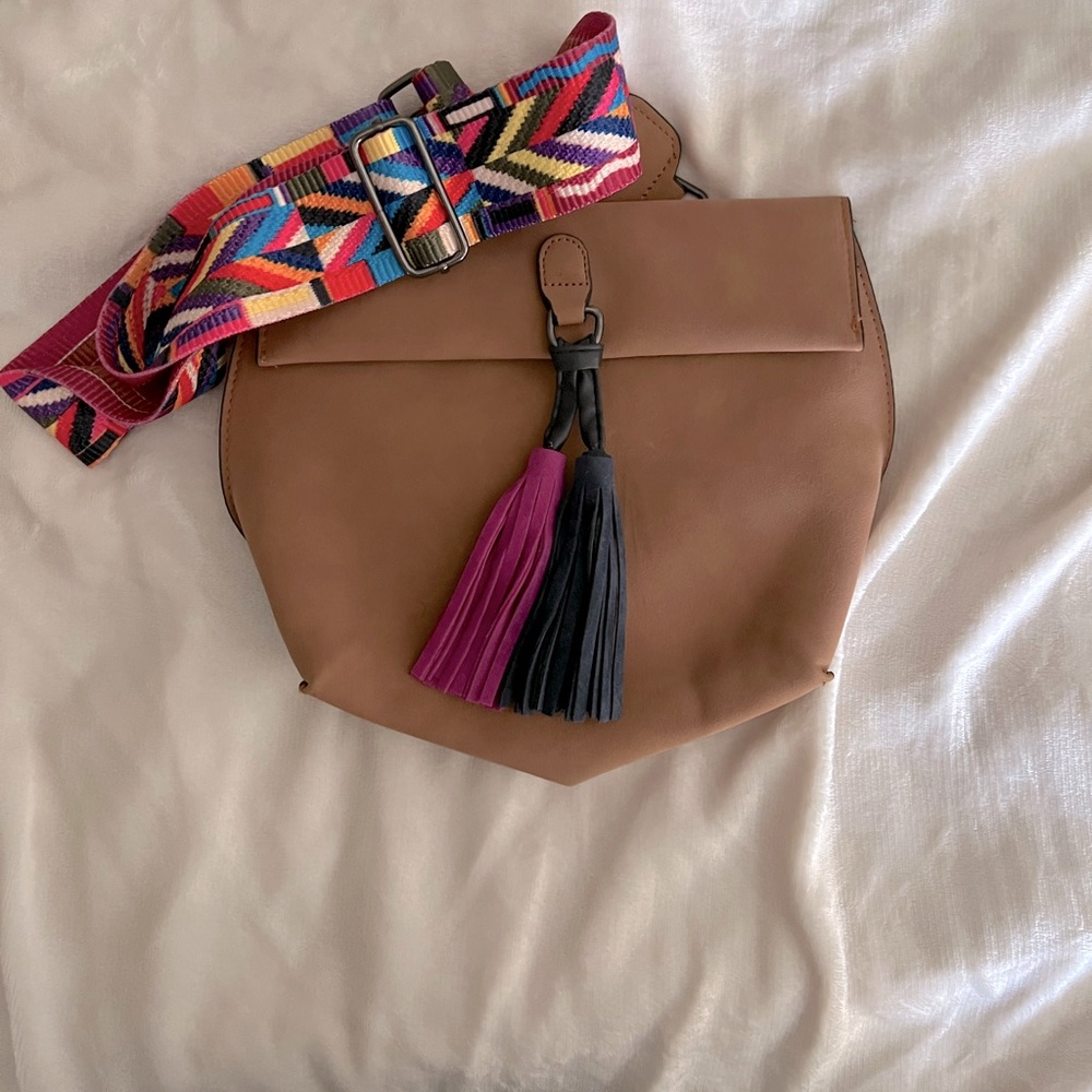 Brand new, never used tan tassel bag with guitar strap.